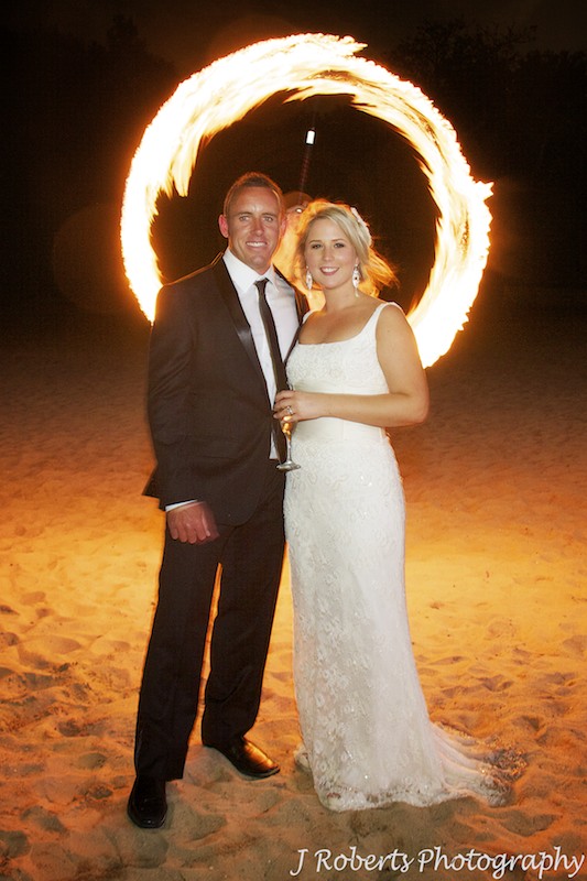 Bride and groom in ring of fire dancing fire - wedding photography sydney